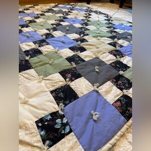 Handmade Patchwork Quilt with Floral Accents